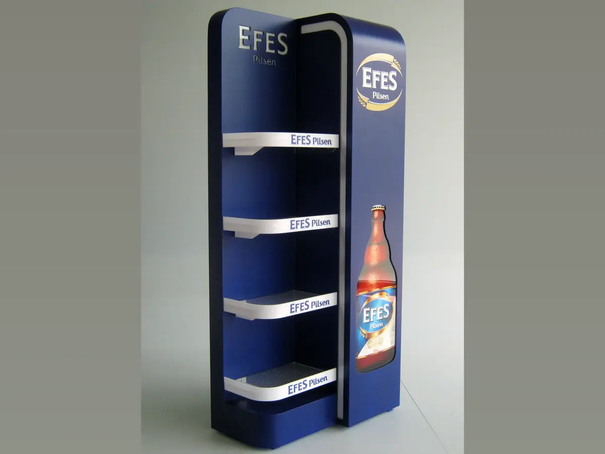 Custom four-shelf floor standing display unit (FSU) with branded header signage, tiered shelving, and a stable floor base