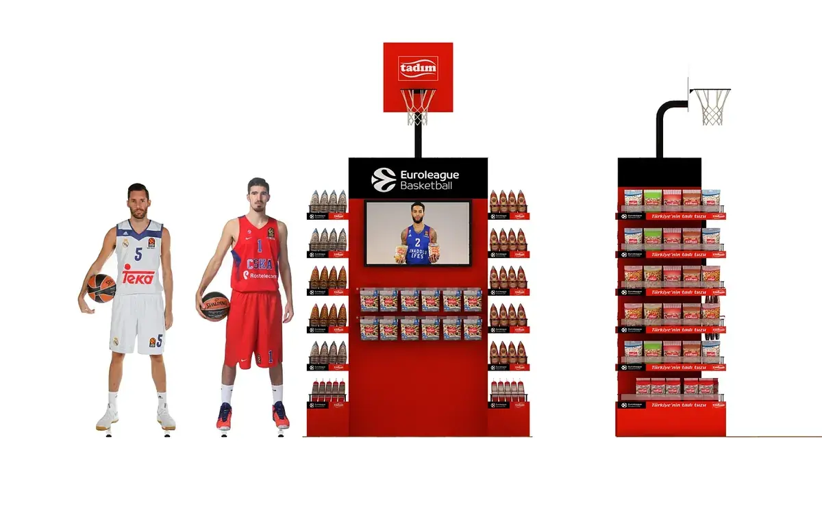 Custom branded endcap display with an integrated digital screen, basketball-hoop topper, and shelf-mounted snack packaging on a red gondola bay